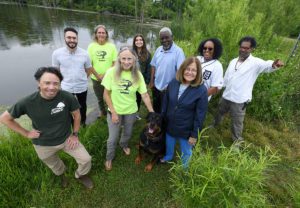 Friends of Rouge Park gather at the Lahser Marsh, Monday, June 20, 2022. They are, from left, Garrett Dempsey, Rob Streit, Paul Stark, Sally Petrella, Cara Held, Arthur Edge, Paula Trilety, Lorraine Harris, and Chris Jackson (and Diesel, the Rottweiler). (Photo by Lon Horwedel, courtesy The Kresge Foundation)